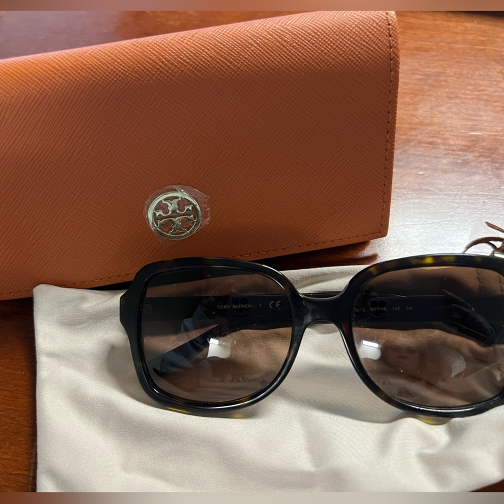 Used Tory Burch sunglasses with pouch and case. Few call outs